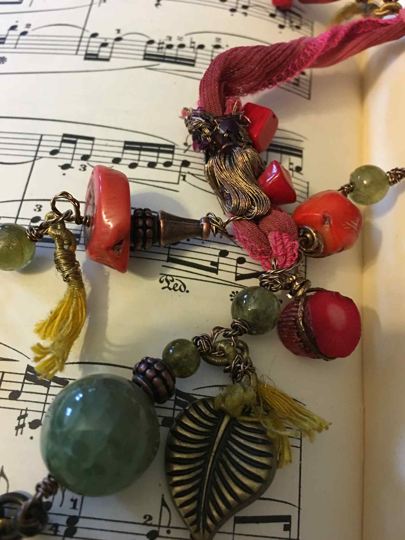 “Opulent Caravan” – Bohemian Silk Ribbon Necklace with Coral, Agate, Carved Rose, and Bronze Charms