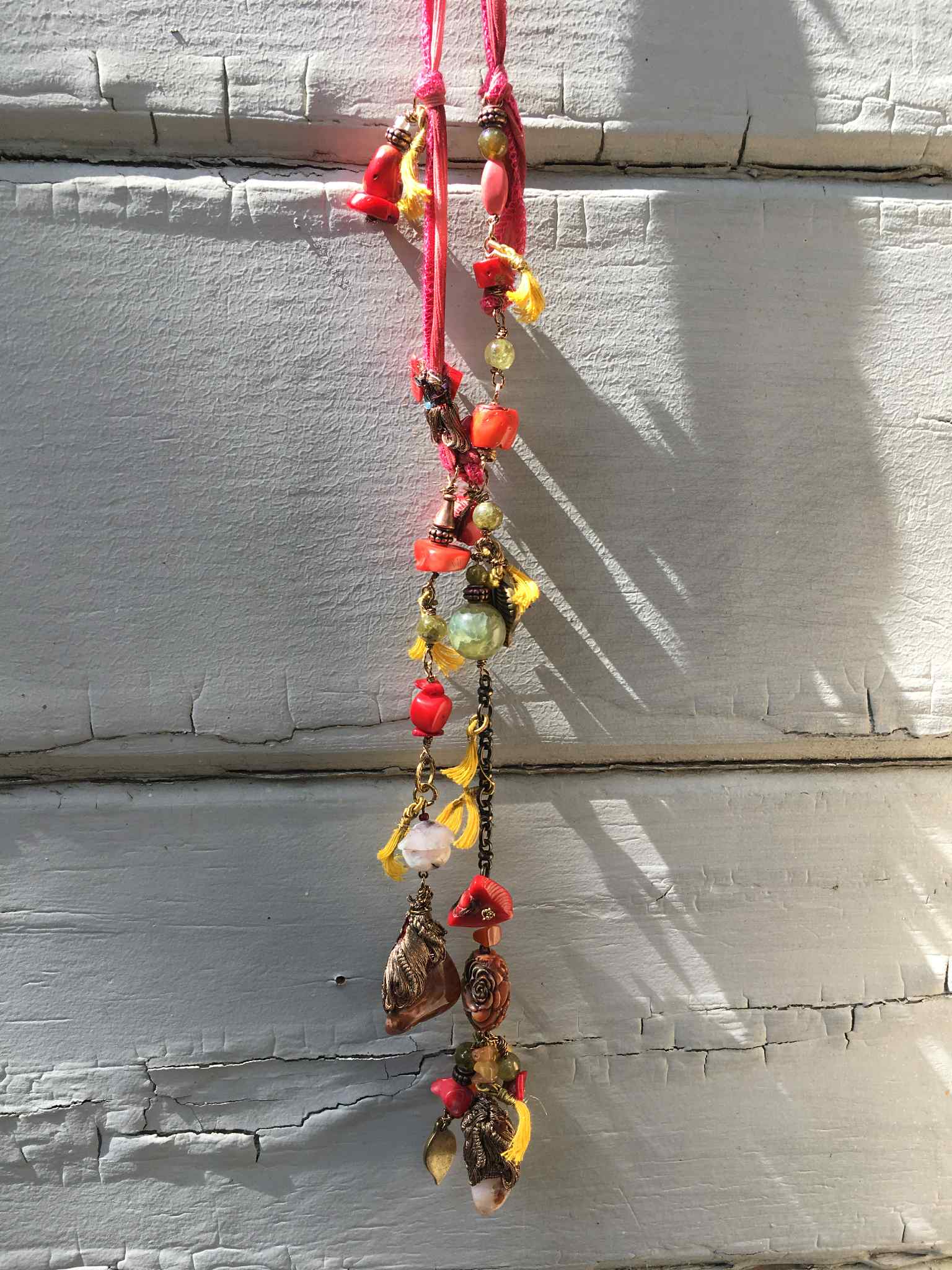 “Opulent Caravan” – Bohemian Silk Ribbon Necklace with Coral, Agate, Carved Rose, and Bronze Charms