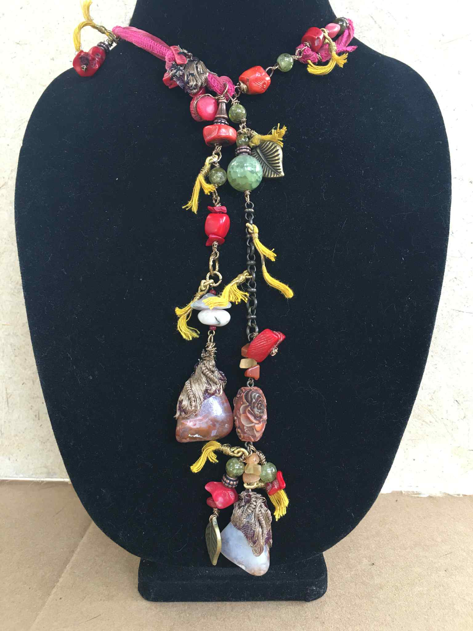 “Opulent Caravan” – Bohemian Silk Ribbon Necklace with Coral, Agate, Carved Rose, and Bronze Charms